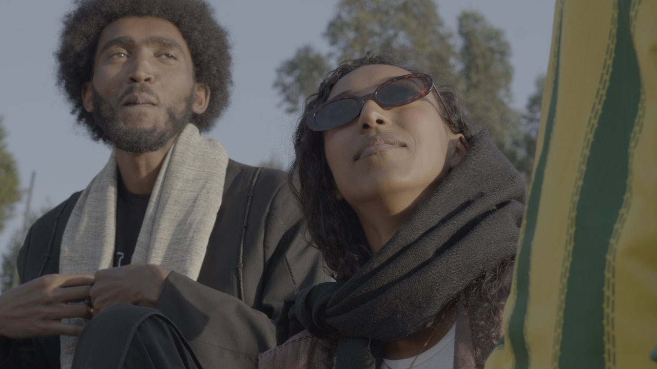 Two performers framed during a Bana Records outdoor production