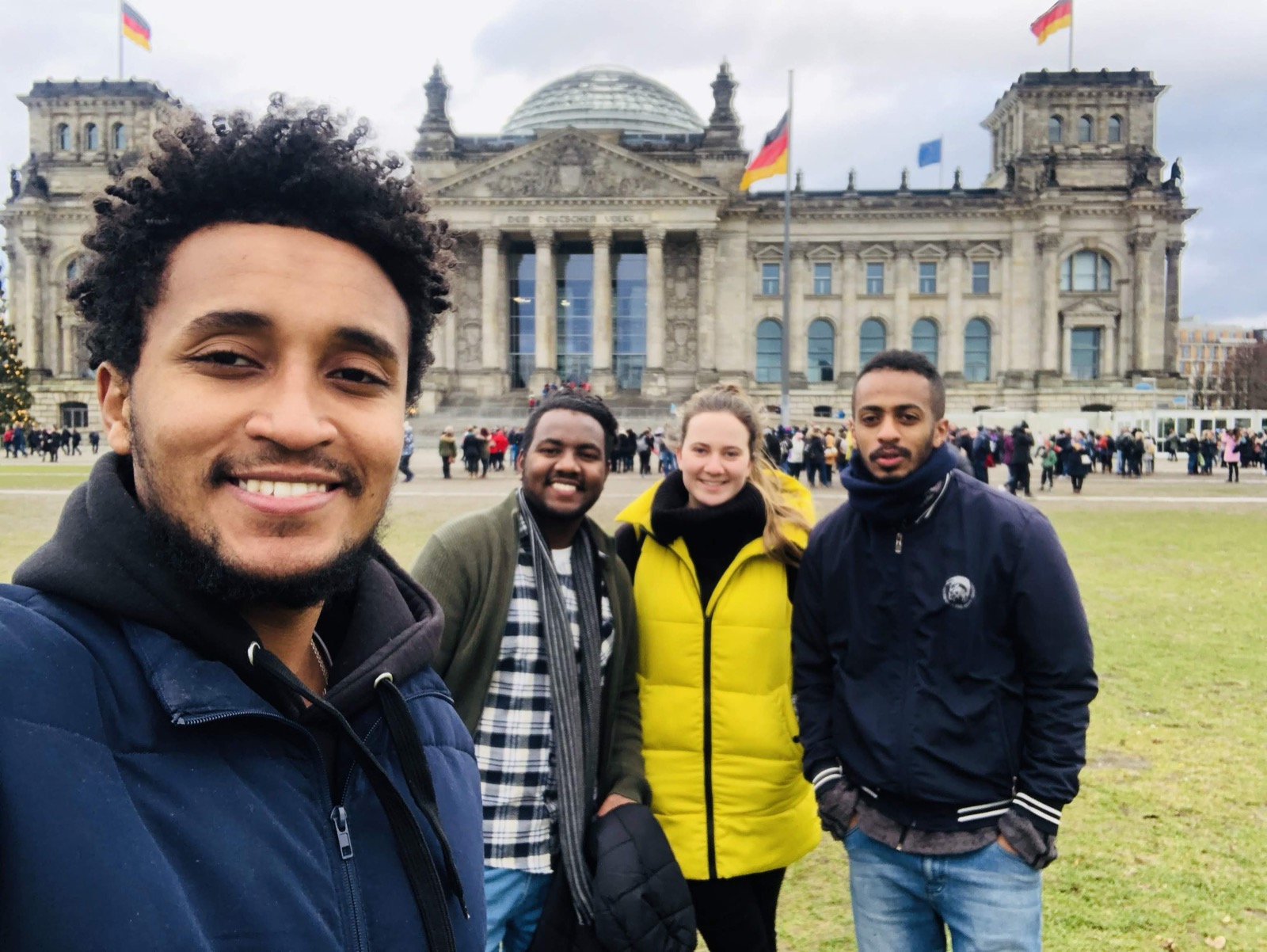 Dawit standing at Brandenburg Gate